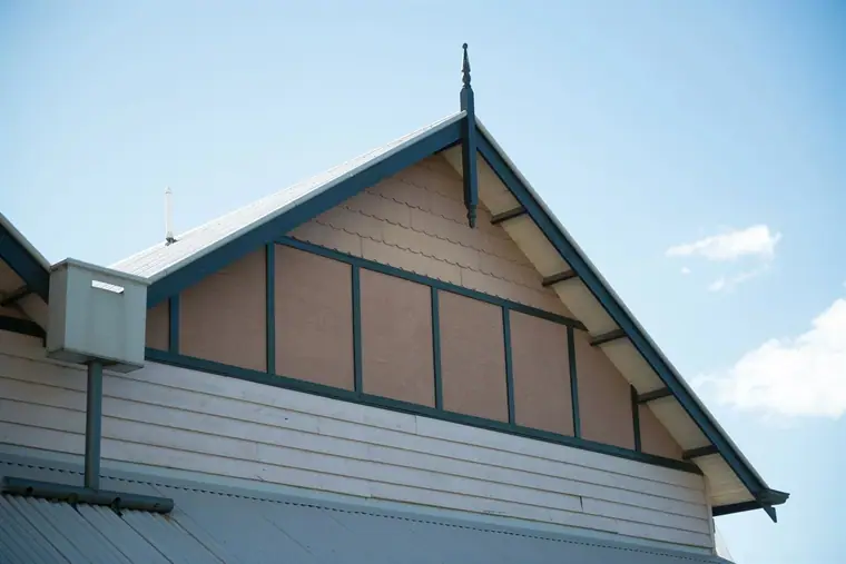 Turned timber gable finial - turned finial standing on a gable apex