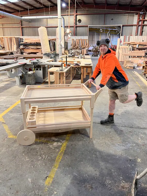 A large custom timber piece on its workshop trolley before dispatch.