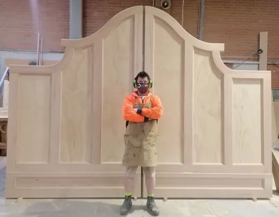 A full-height bespoke pedestrian gate with an arched centre panel.