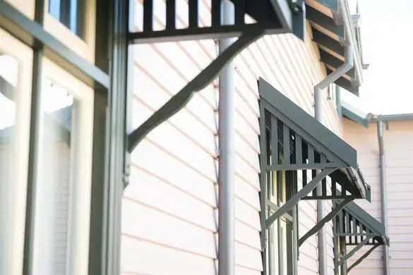 Timber window canopy - on a painted weatherboard wall