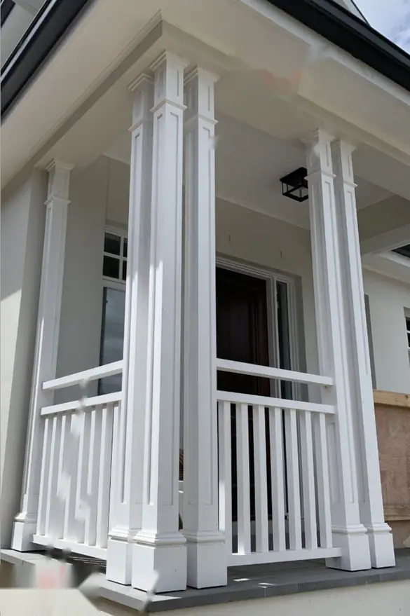 Square panelled porch posts with a slatted balustrade between