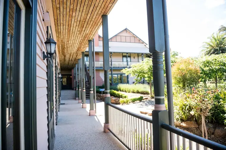 Turned timber verandah post - colonnade of turned verandah posts under a lined ceiling