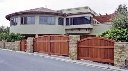 Emmet timber gate, reddish-brown boarded gates along a street frontage