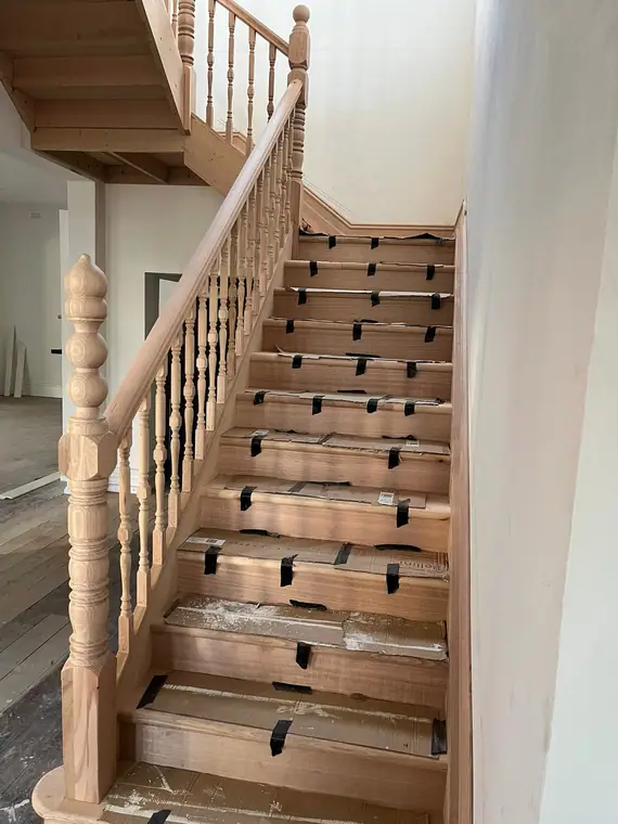 Timber staircase with turned balusters and a bobbin newel post