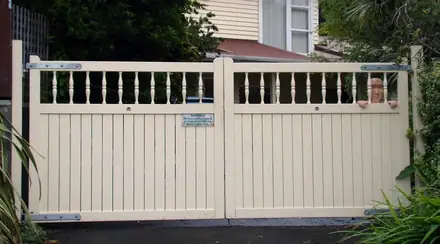 Mitchel timber gate, cream boarded gates with a pierced top rail, in place