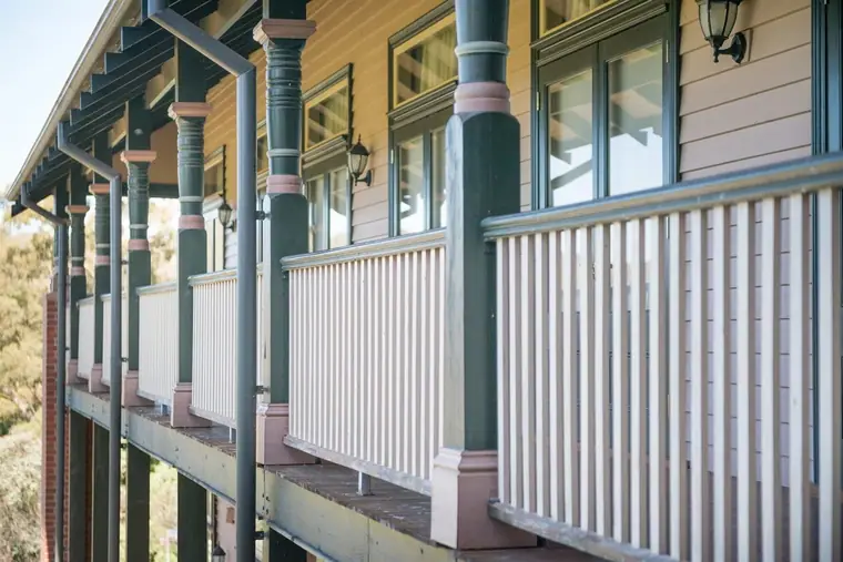 Timber balustrade - white verandah balustrade running across a cream Federation facade
