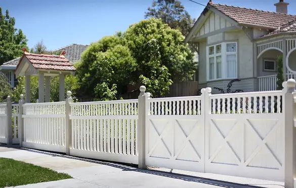 White timber front fence and cross-braced driveway gates on a period frontage