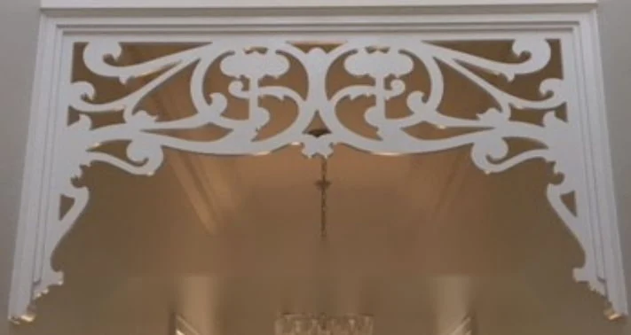 Decorative timber fretwork installed in an opening