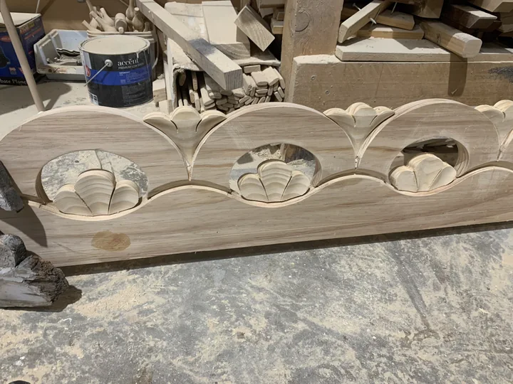 New timber fretwork reproducing the curved openings and motifs of the original sample