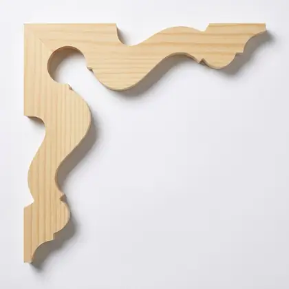Photograph of a scrolled corner bracket. Trade code CB8.