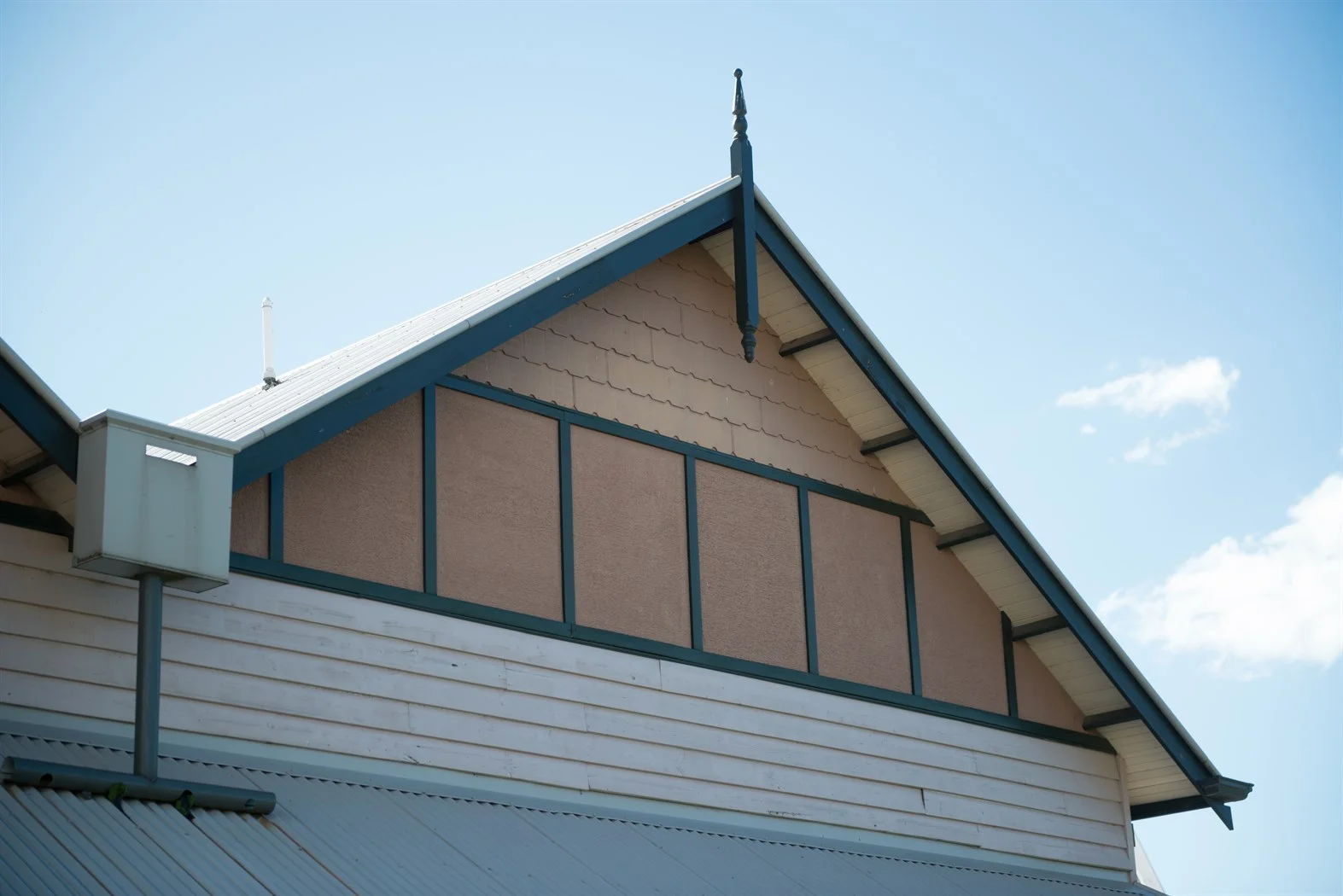 Timber gable finial standing on a gable apex