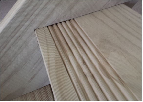 Close-up of the reeded, grooved surface of a timber stair tread
